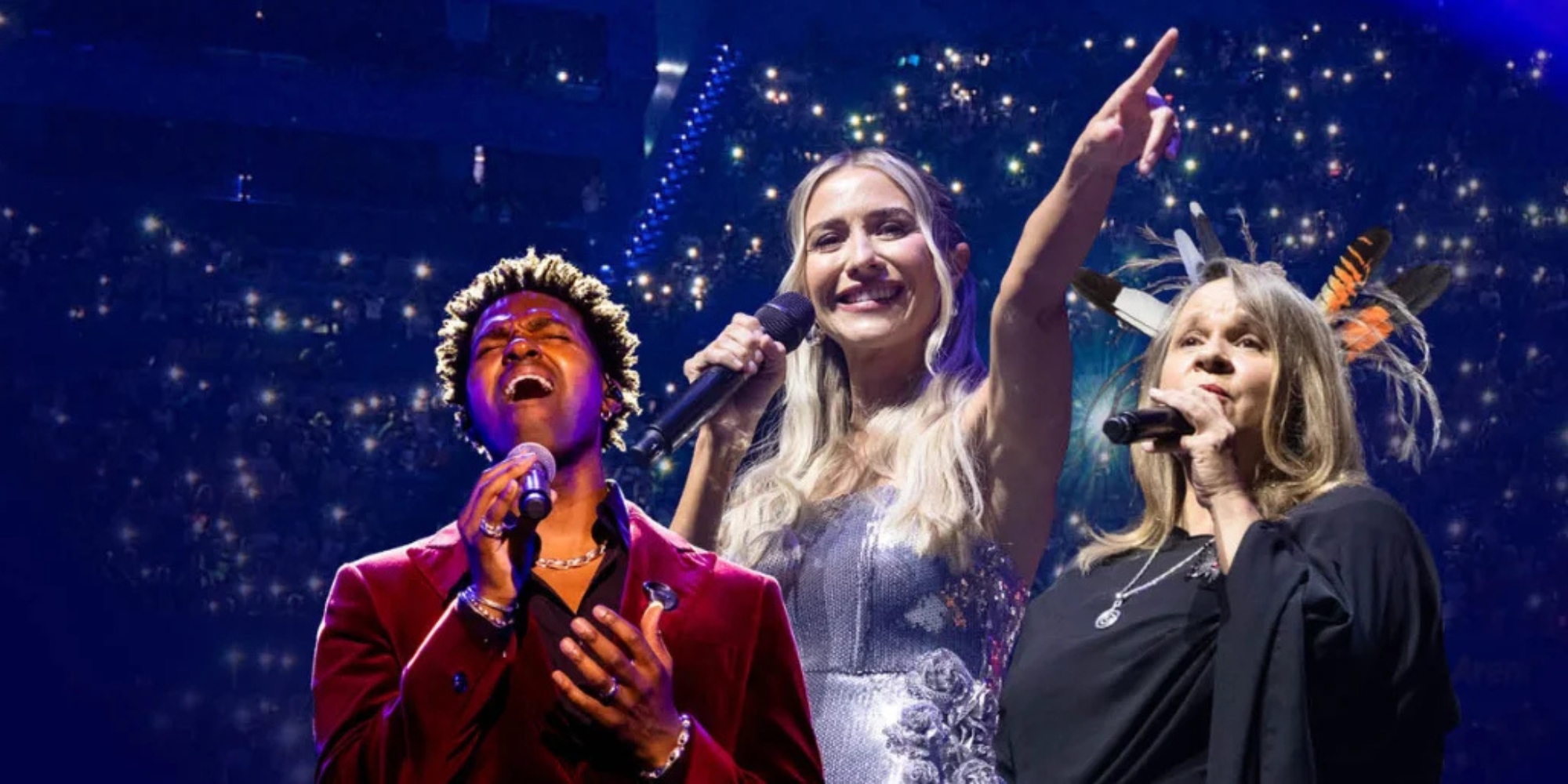 Lotterywest Christmas Spectacular with the West Australian Symphony Orchestra (WASO) and Lotterywest banner. The banner consists of a background of a crowd in seats with glowing lights. There are images of three people holding microphones and singing in the foreground.