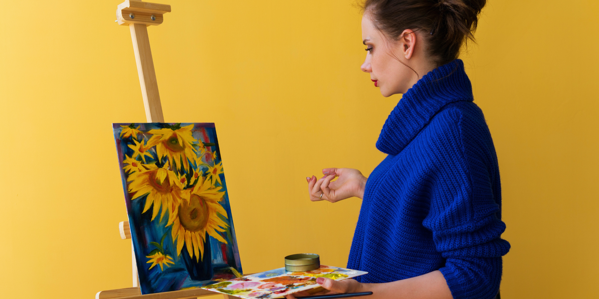 An image of a woman painting sunflowers - Kiind's What's on activity and event guide