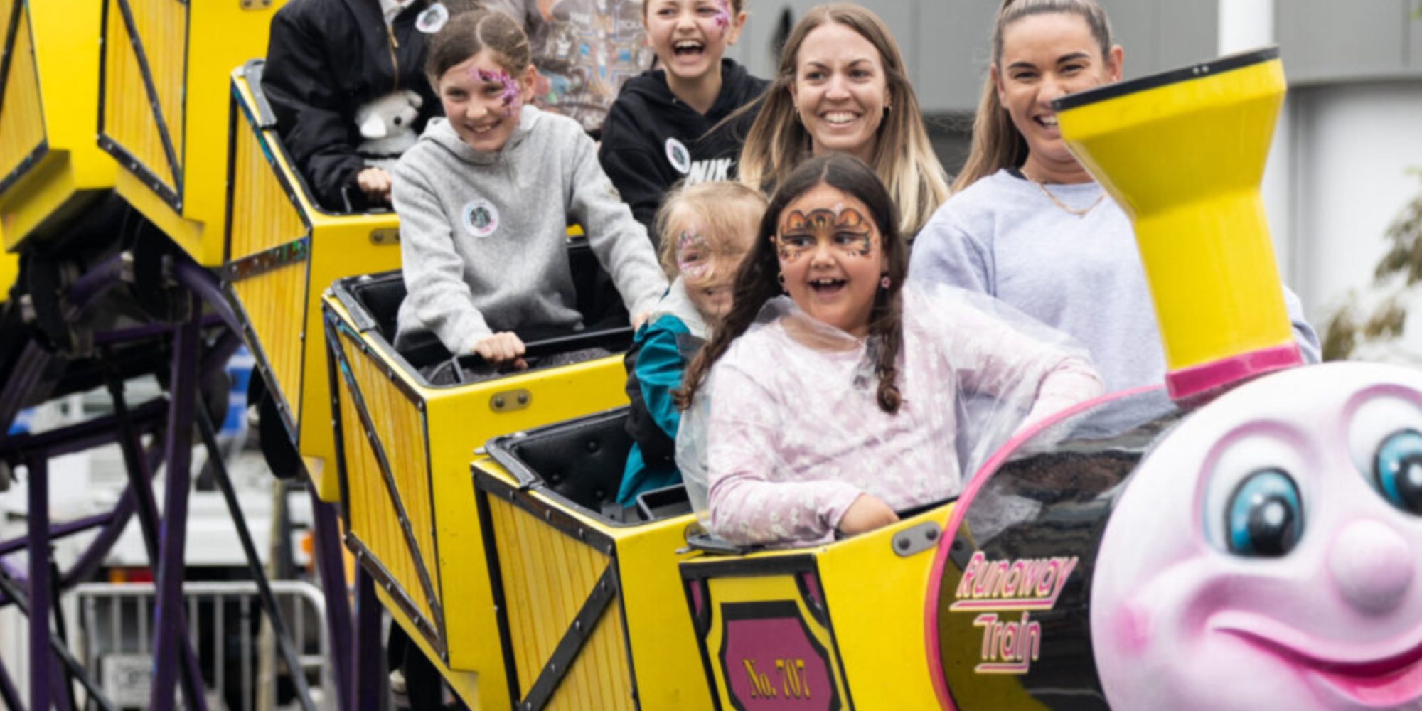 Children on a rollercoaster at the Telethon Family Festival.