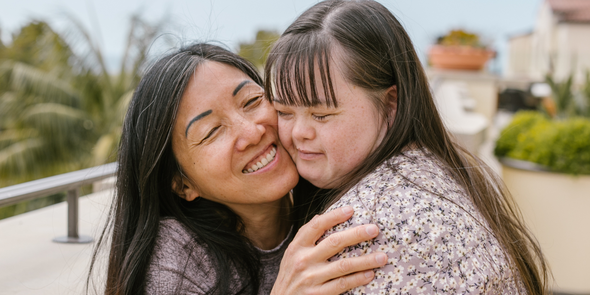 A down syndrome woman hugging her mother