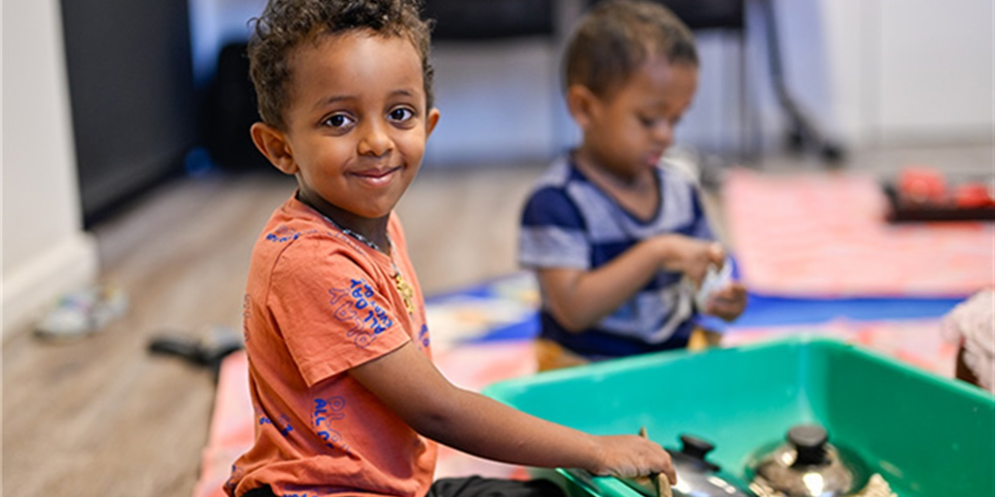 Two children playing at a sensory station