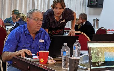 Graham Gordon, of Two Mile, gets some help from Maree Cali, of Department of Resources.