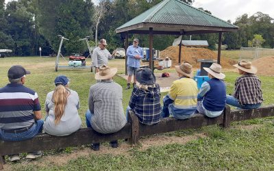 Attendees at the field walk day listen closely to landholder Paul Tippett as he explains the result of his trial work.