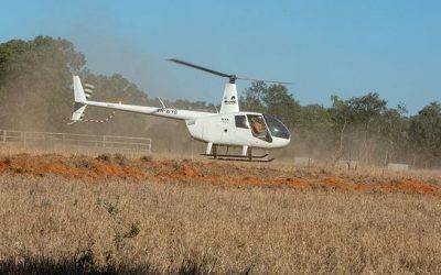 Workshop participants arrive by chopper. Pictured is pilot and grazier Chris Wendelborn