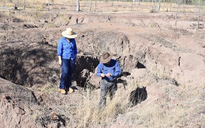 Acting LDC landscape remediation officer, environmental engineer Sheyanne Frisby and John Day assessing erosion features at Tabletop Station.