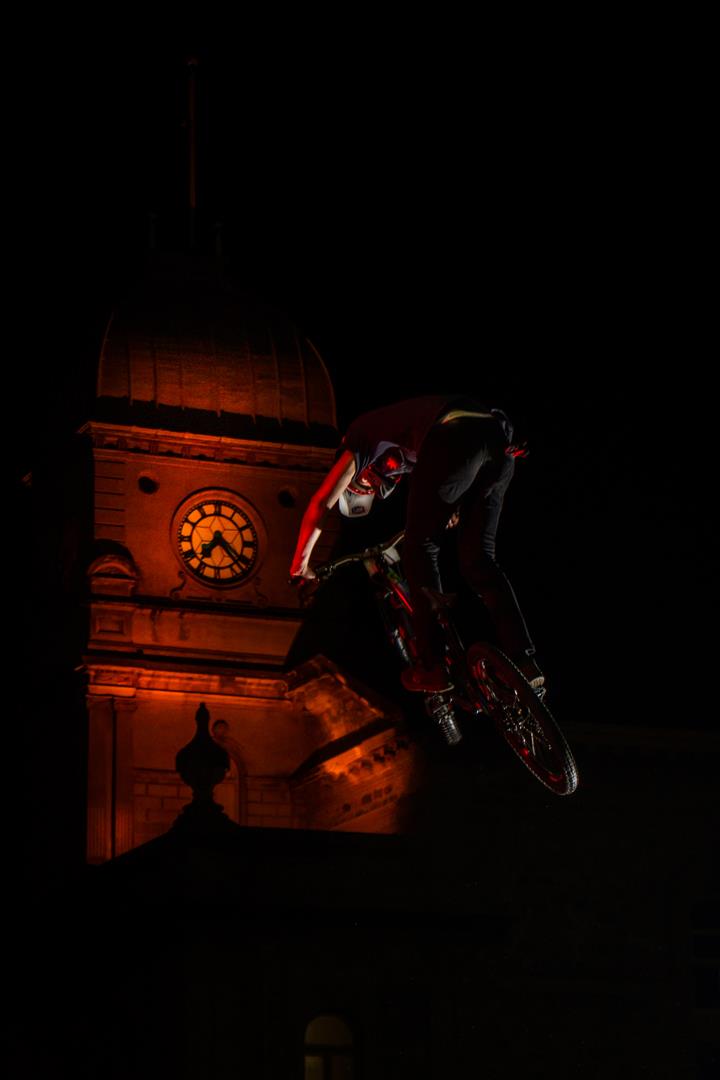 Hangtime in the jump competition with the town hall in the background. 