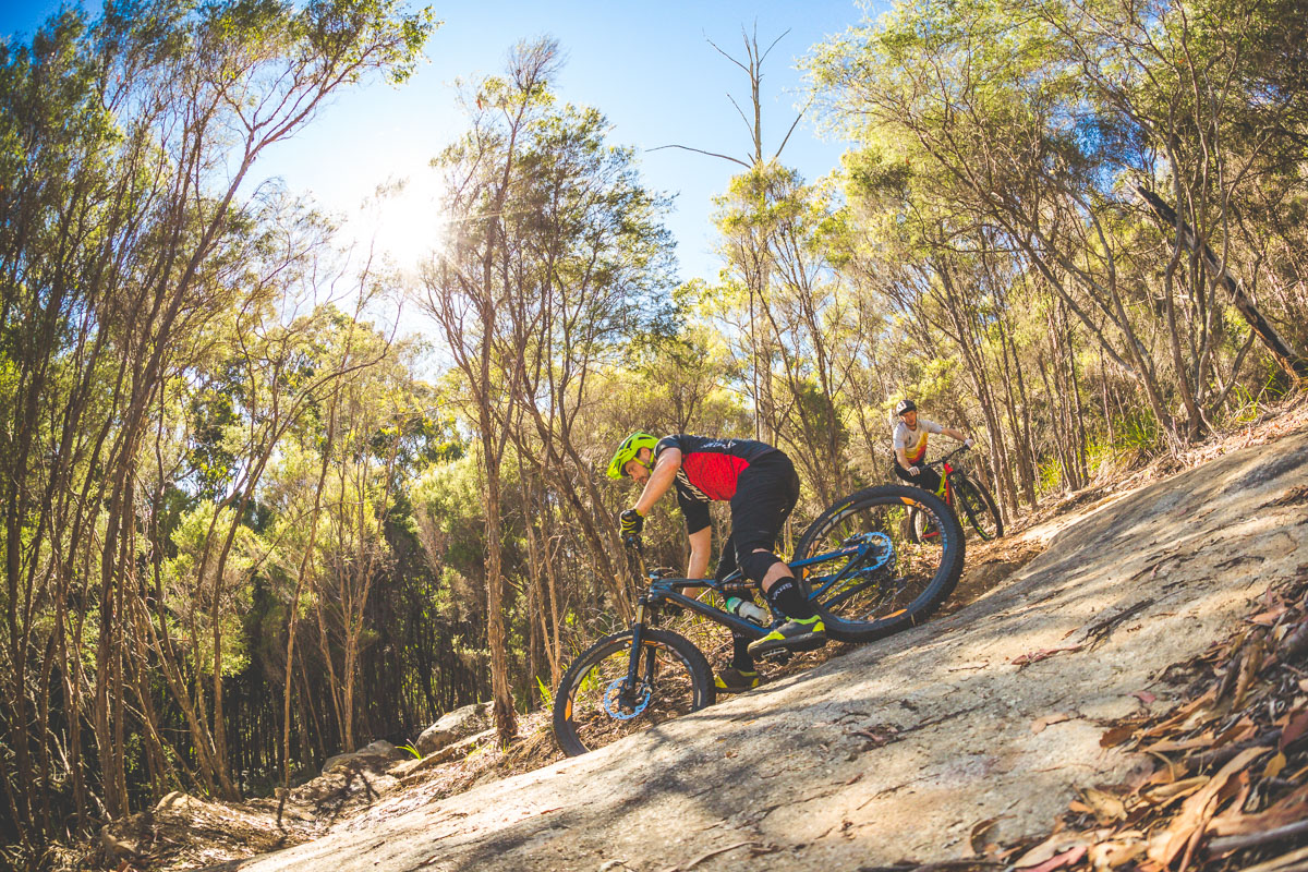 Rhys tipping it in on a bare granite slab.