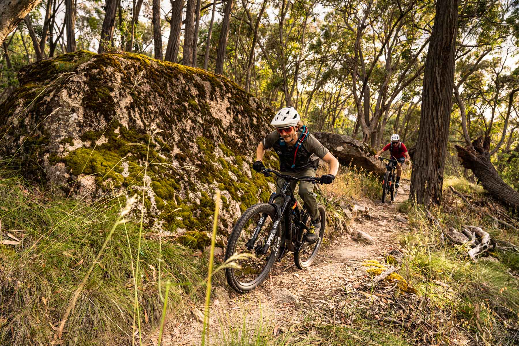 Riders among the mossy rocks in Beechworth