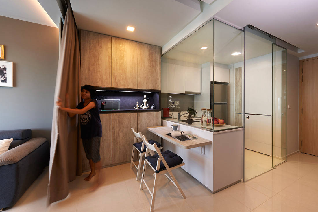 This petite apartment efficiently uses the space (or lack thereof) for living and storage
