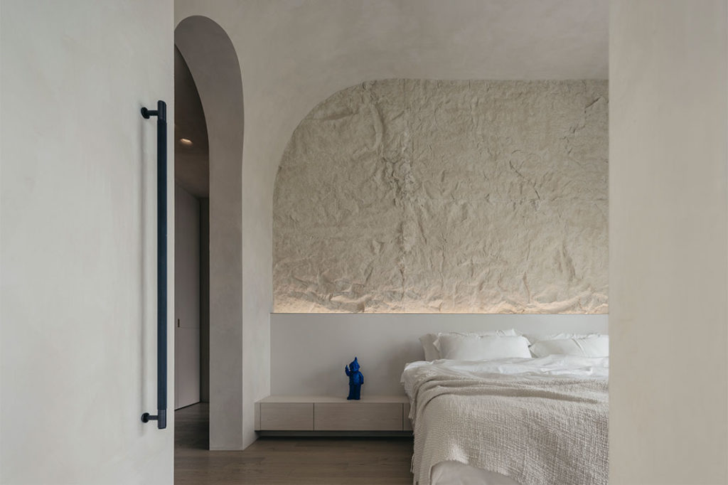 bedroom with rock feature wall