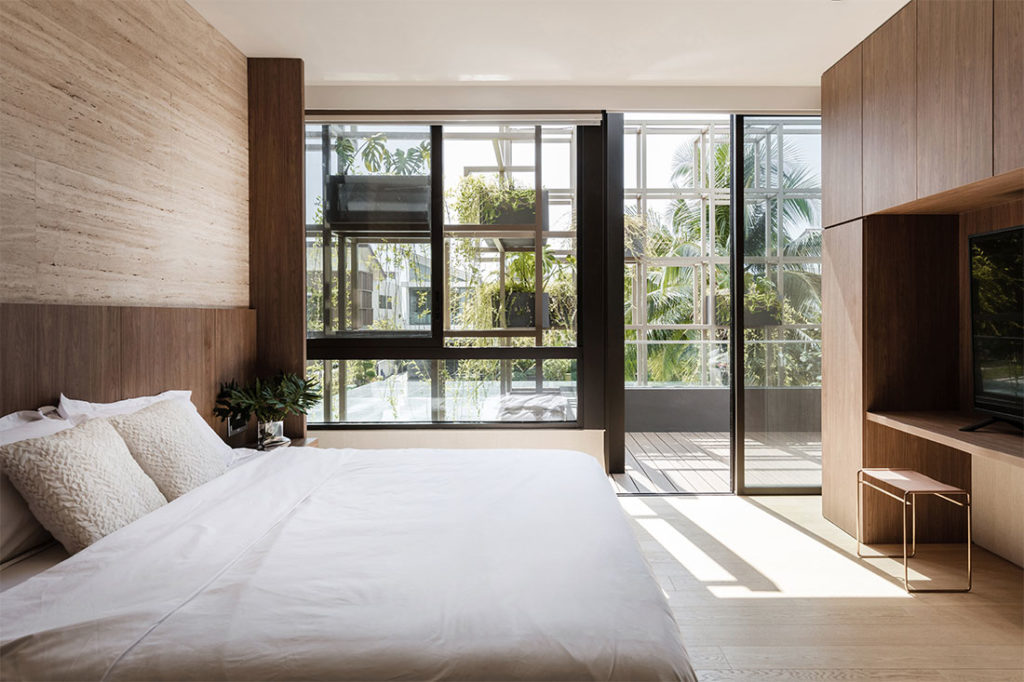 Bedroom with green wall facade