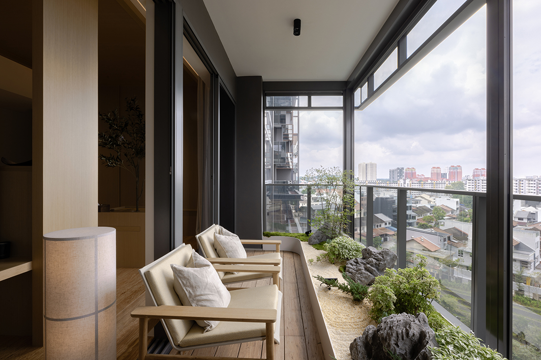 Inside a Jadescape condo with a balcony zen garden