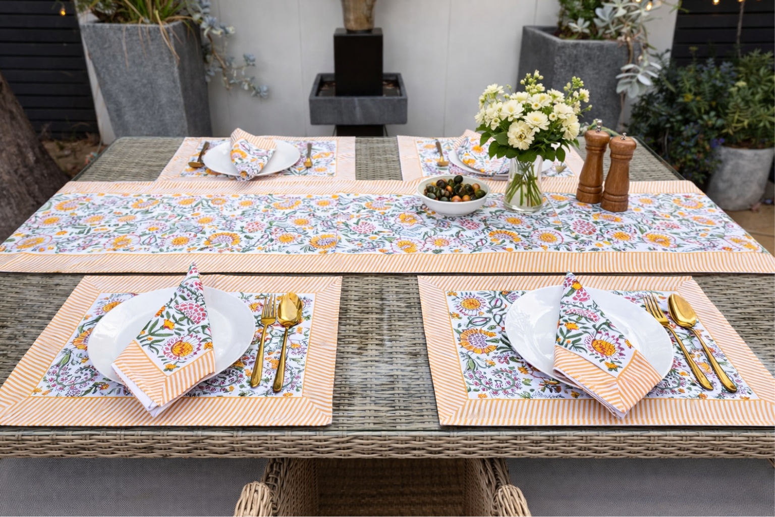 Garden Party table setting with layered floral textiles