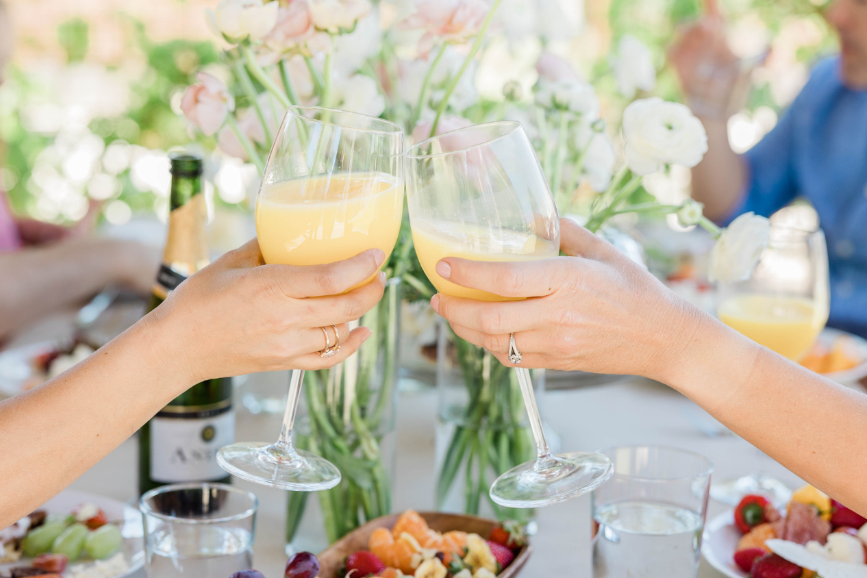 Elegant wine toast with Crimson Courtyard table setting