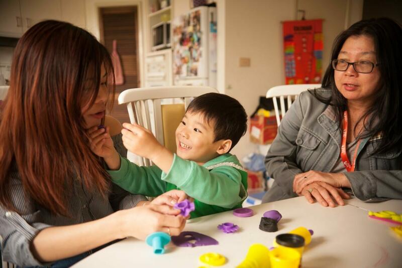 Noah's Ark therapist observing a parent and child playing with playdough.