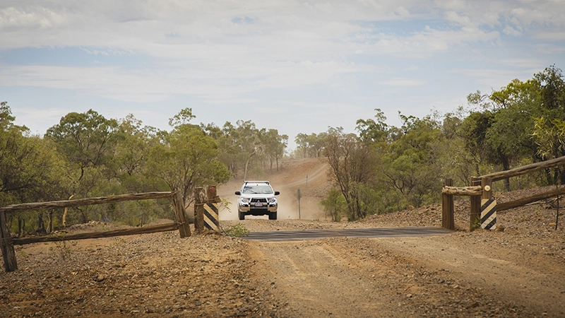 Photo of car travelling on a dir road: The Burdekin Landscape Repair project builds on work previously undertaken by NQ Dry Tropics.