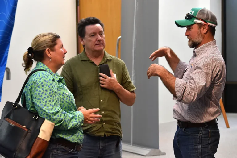 Megan Willis and Niall Connolly, Department of Primary Industries, speaking with Chris Poole, NQ Dry Tropics (right).