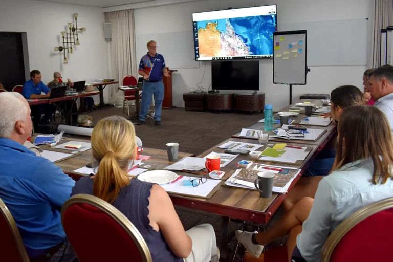 (L-R) Scott Devaney and Peter Webley, Department of Natural Resources and Mines, answer questions about vegetation management  from landholders.