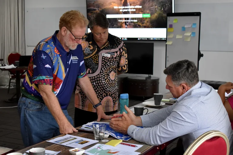 (L-R, standing) Peter Webley and Scott Devaney, Department of Natural Resources and Mines, answers questions from Barry O'Sullivan, Glenalpine Station.