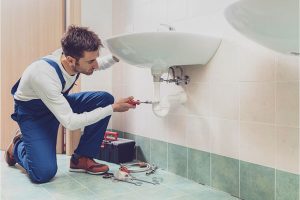 Home Plumbers fixing tubes