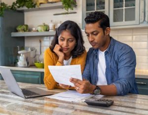 couple reviewing their electricity bill