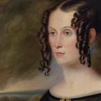 Oil painting of a woman with ringlet curls arranged down both sides of her face.