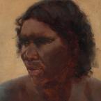 A head and shoulders portrait of an Aboriginal woman looking off to her right.