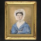 Miniature portrait in a golden frame of a woman 