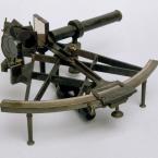 A metallic device with a viewing scope and measurements