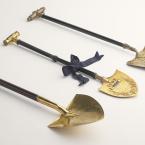 Three golden engraved spades