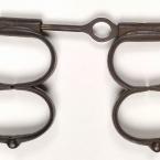 2 sets of iron manacles