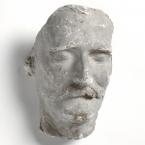 A plaster cast of a face with a large moustache