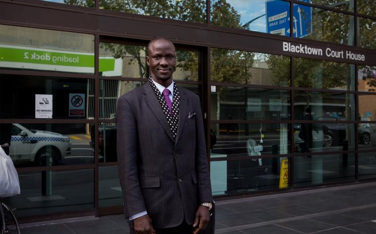 Deng standing in front of Blacktown Court House.
