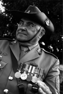 A black and white photo of Colin in full dress uniform with his medals