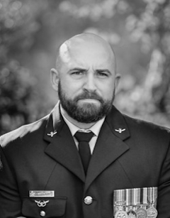 A black and white photo of FLGOFF Henry in his RAAF dress uniform