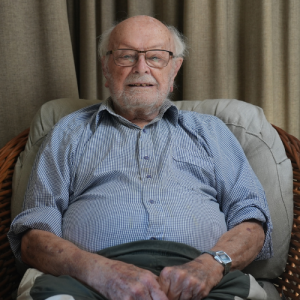 Photos of Peter Watson and his flying log book.