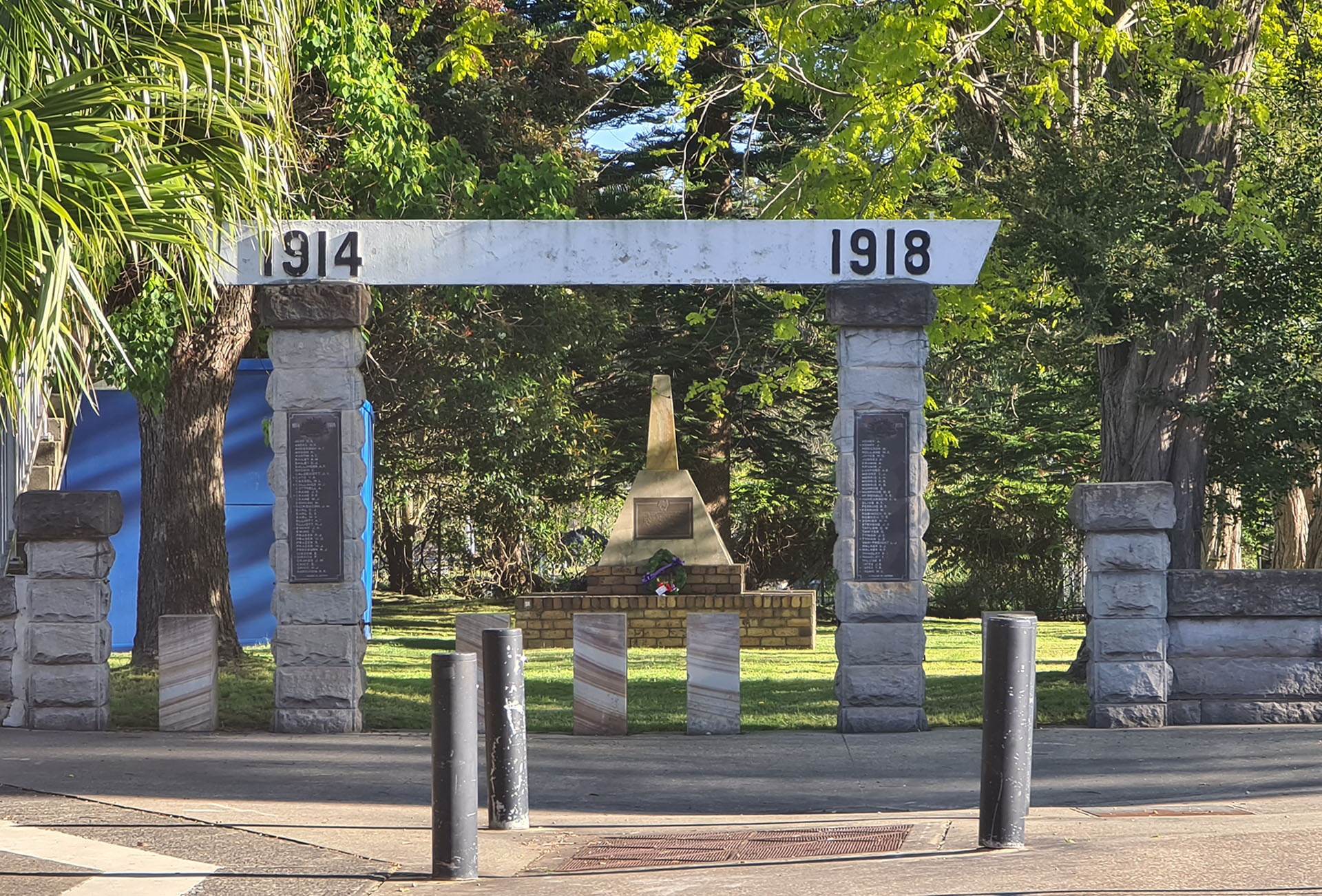 Ourimbah-Lisarow Australian Armed Forces Bicentennial Memorial, seen through Ourimbah First World War Memorial Arch