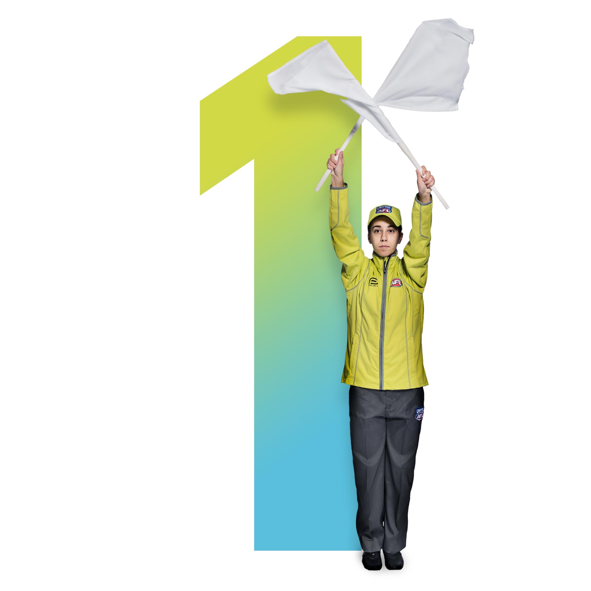 An umpire holding up flags in front of the number 1
