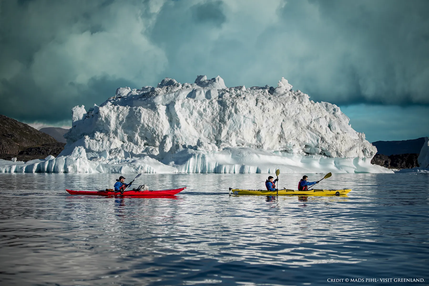 Kayaking past Icebergs in Disko Bay near Oqaatsut, Greenland
